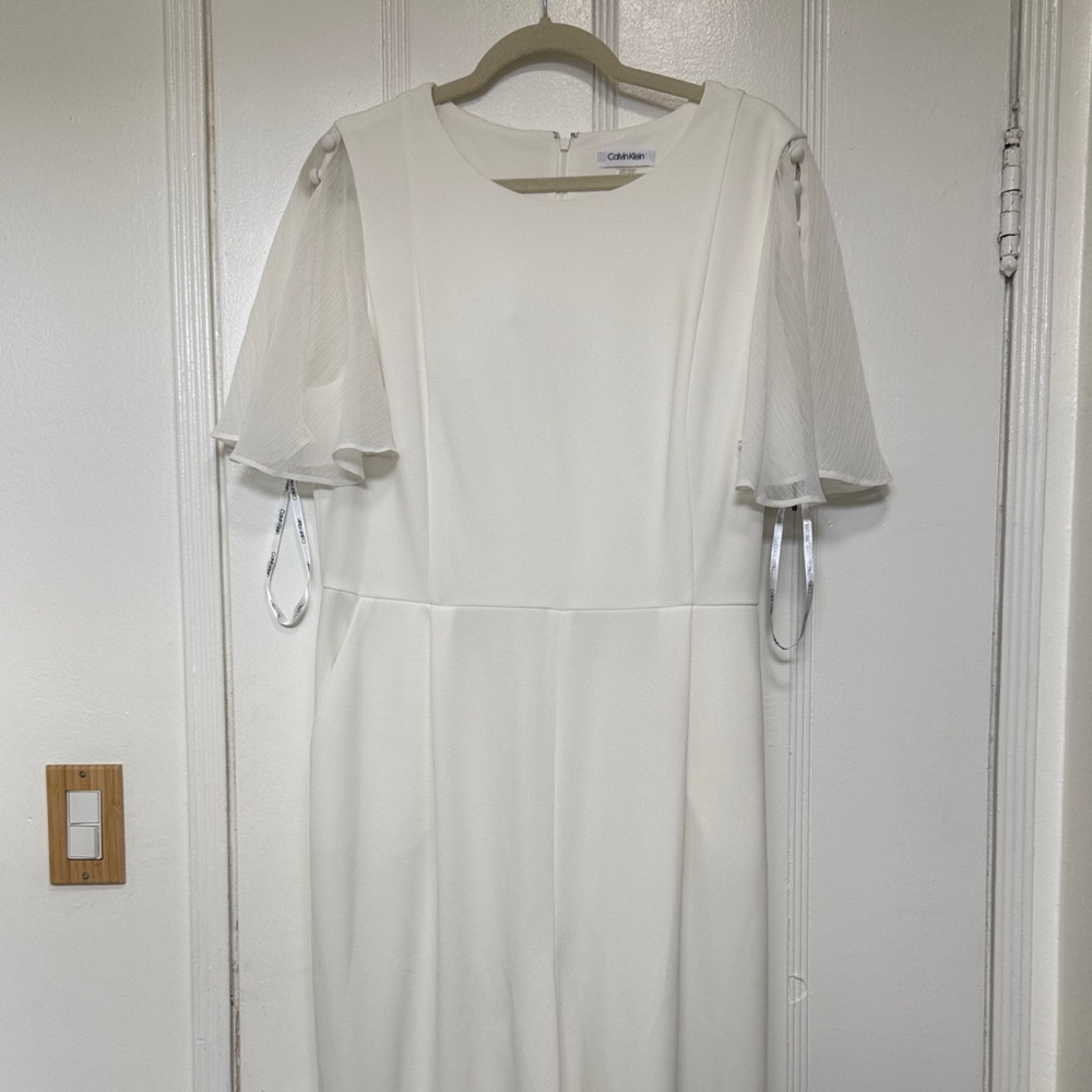 Calvin Klein White jumpsuit with Sheer Sleeves